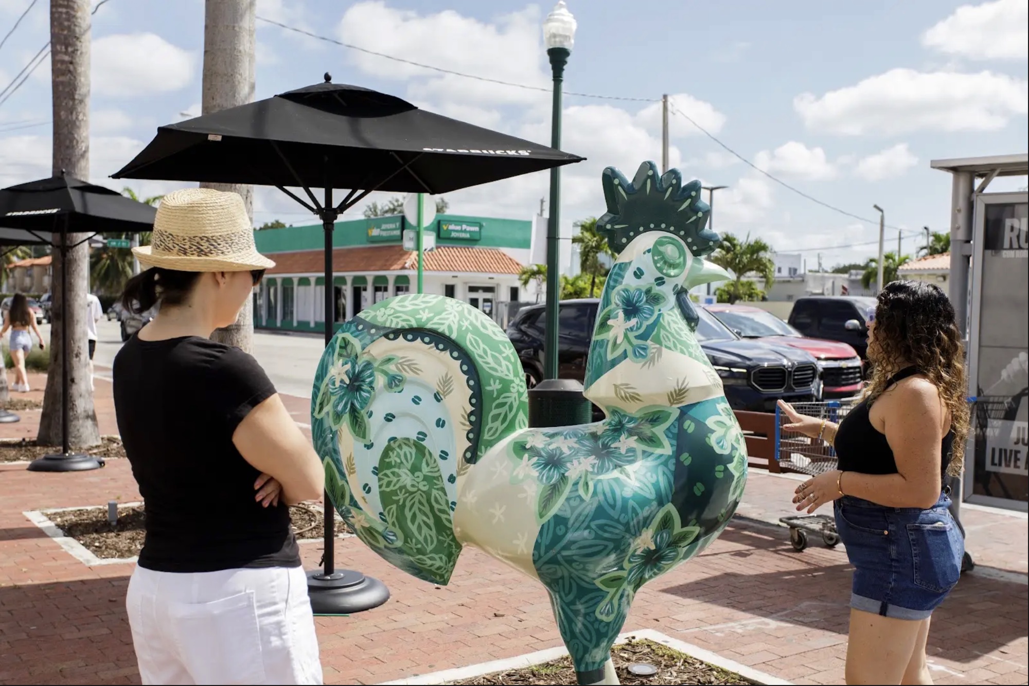 Hand-painted rooster statue on Calle Ocho during a self-guided walking tour of Little Havana