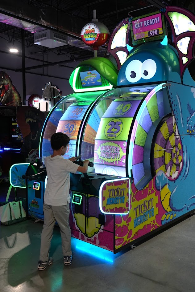 A boy playing Ticket Monster at 810 Entertainment