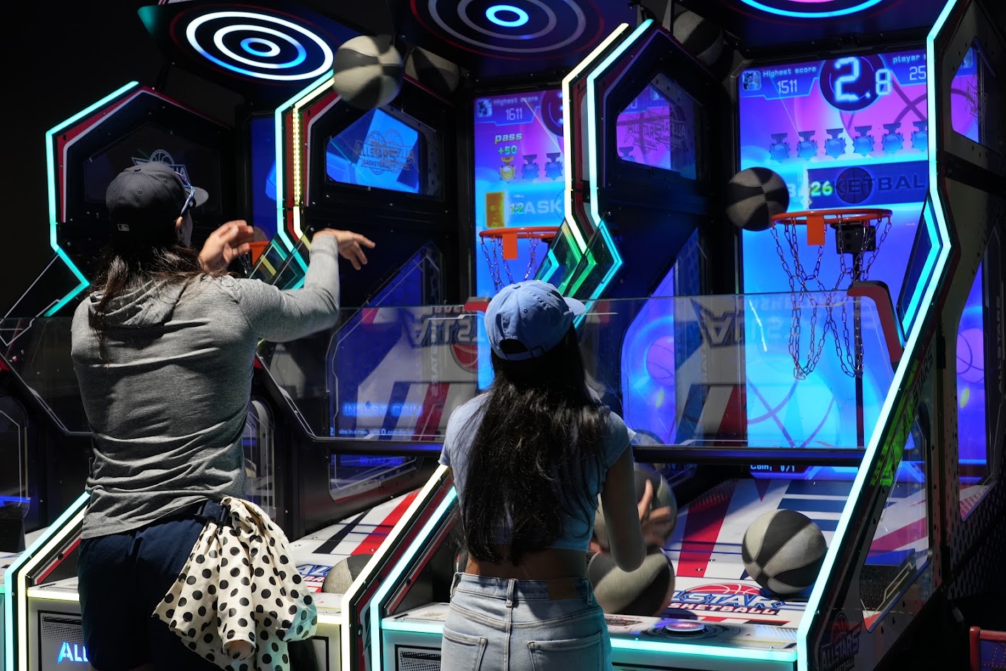 Moms shooting hoops at the All Stars basketball arcade
