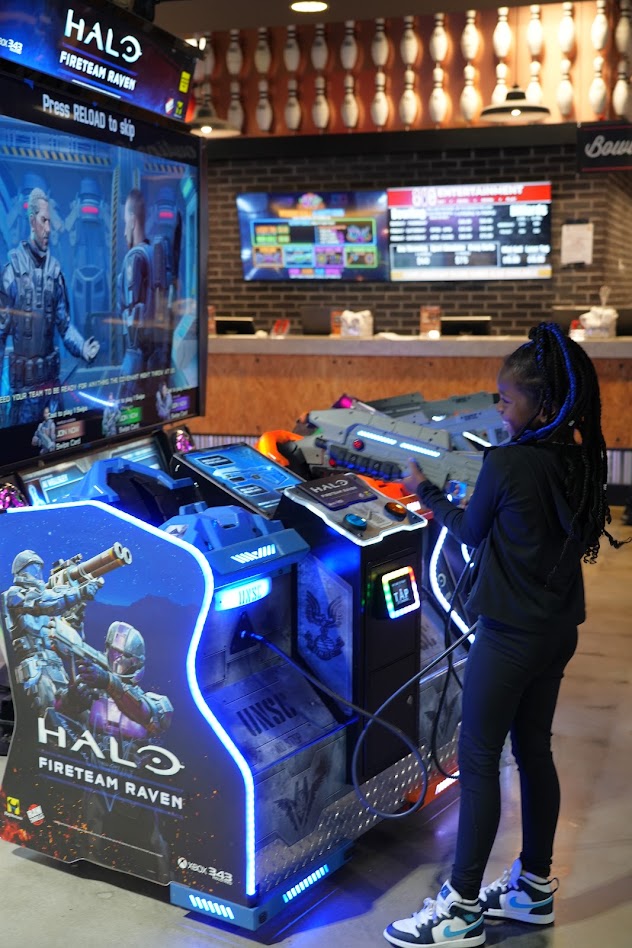 A girl playing Halo Fireteam Raven