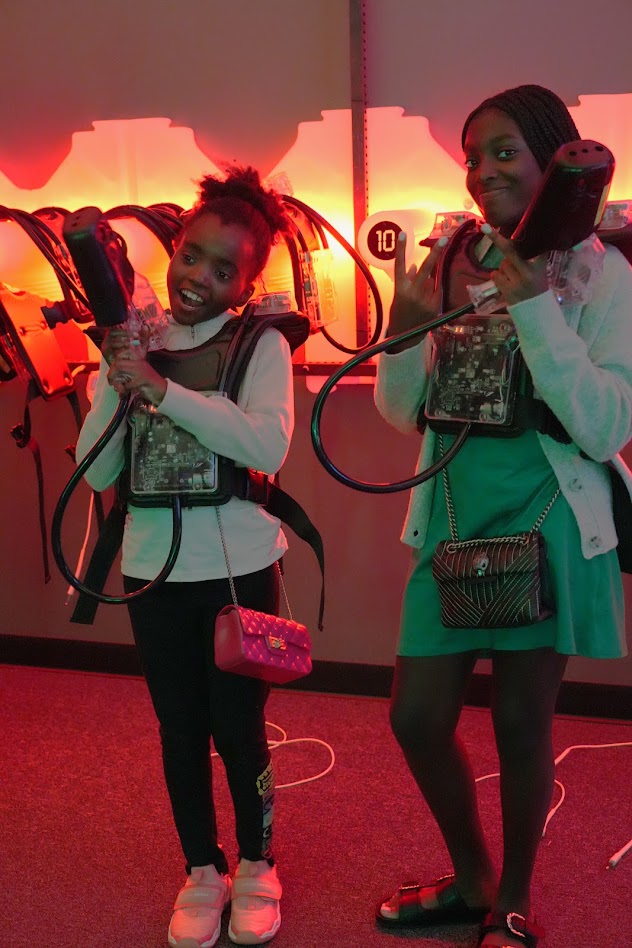 Two girls suited up for laser tag
